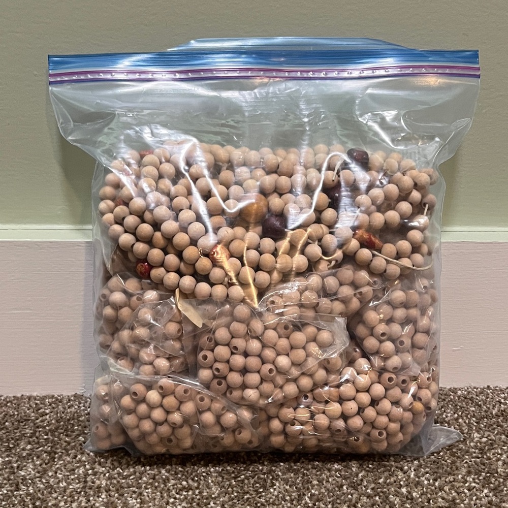Bag of Wood beads 3/8” round 5/32” hole